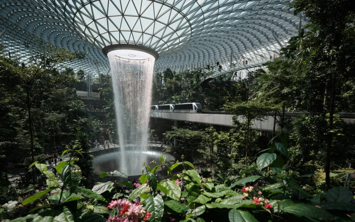 The Rain Vortex falling through the glass dome of Jewel at Changi Airport